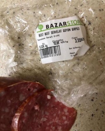 "Bazarstor"dan aldığı kolbasanın içindən şüşə çıxdı – FOTO